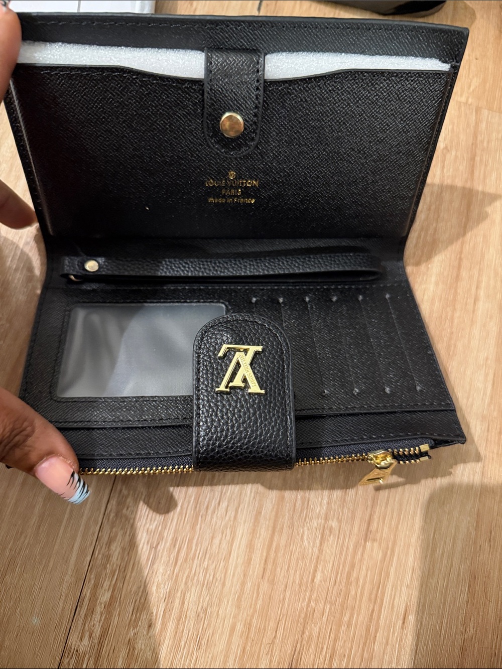 Louis Vuitton Black Leather Wallet with Gold Hardware and LV Accent